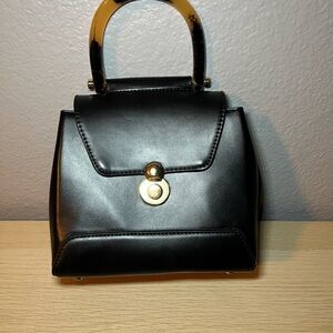 Madison West  Black Handbag with Gold Accents